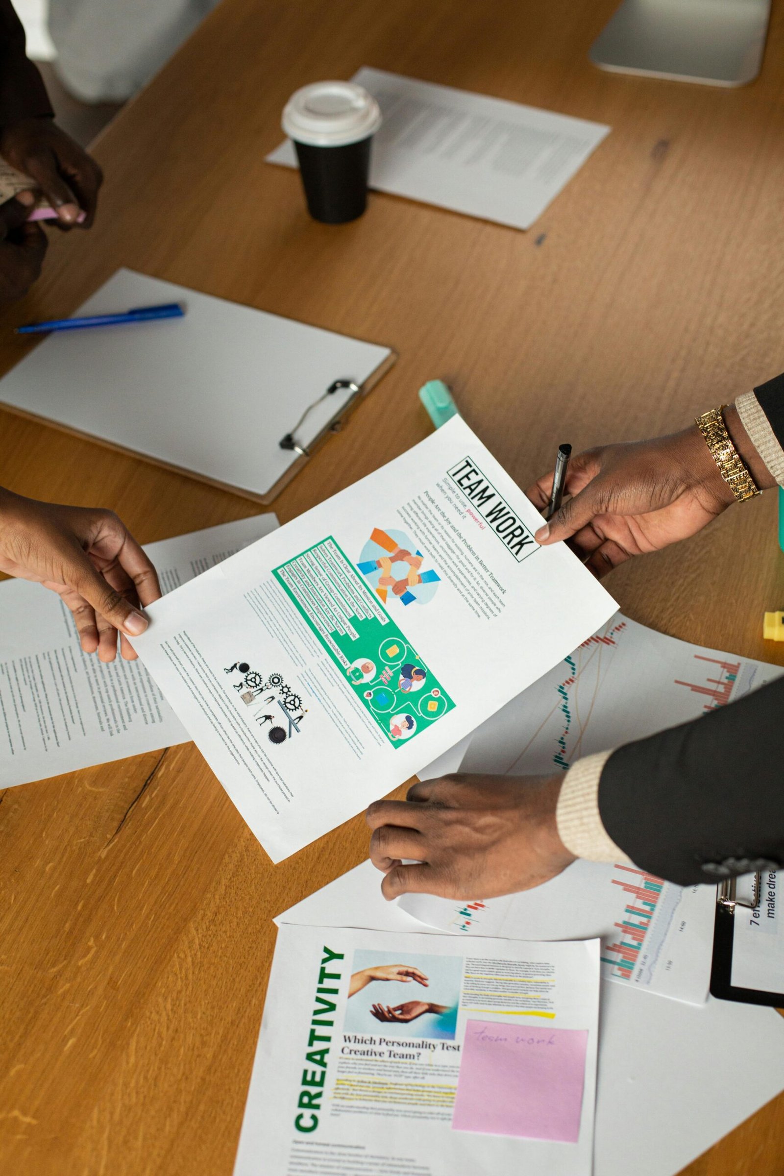 Top view of a collaborative business meeting with focus on teamwork and creativity